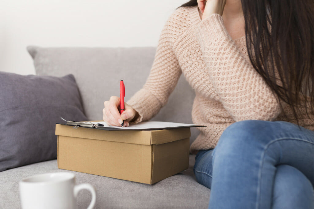 woman creating shopping list